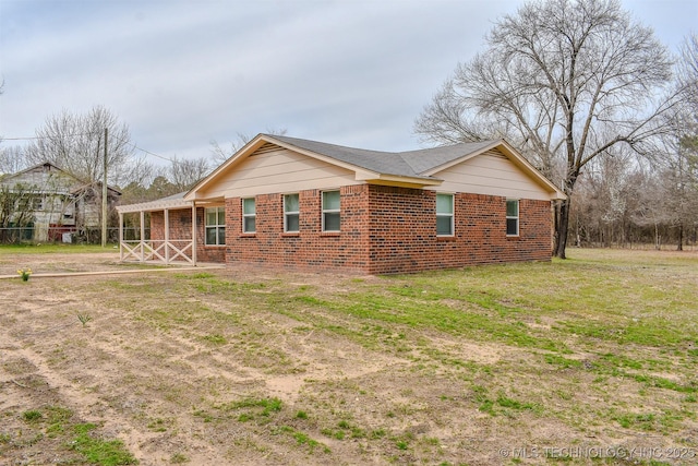 415347 E 1912th Rd, Antlers, OK 74523 - view of side of home with a yard and brick siding