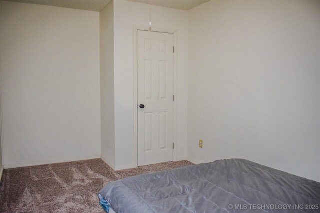 415347 E 1912th Rd, Antlers, OK 74523 - unfurnished bedroom with carpet flooring and baseboards