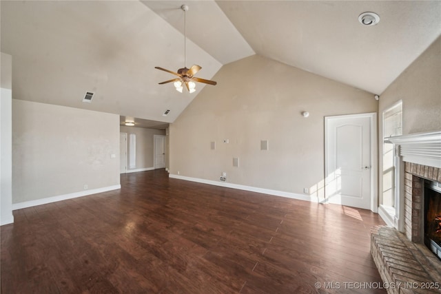 unfurnished living room featuring visible vents, a brick fireplace, baseboards, wood finished floors, and a ceiling fan