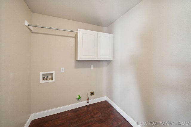 laundry area featuring gas dryer hookup, hookup for an electric dryer, dark wood finished floors, cabinet space, and washer hookup