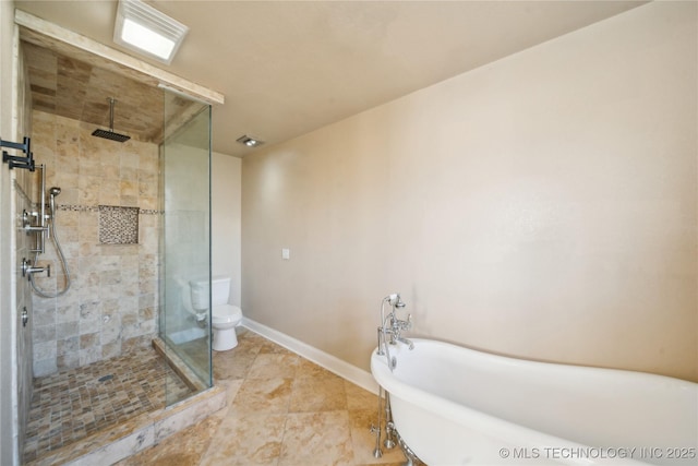 bathroom with baseboards, a soaking tub, a stall shower, tile patterned flooring, and toilet