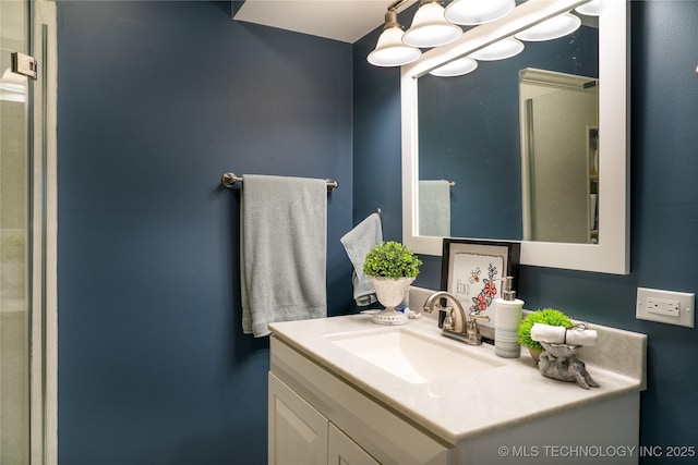 bathroom featuring vanity and an inviting chandelier