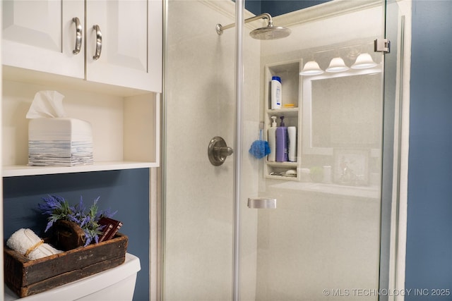 full bathroom with toilet and a shower stall