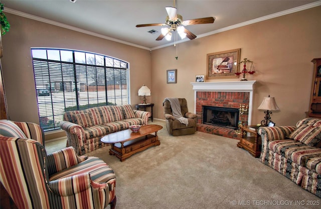 carpeted living room featuring visible vents, a fireplace, ceiling fan, and crown molding