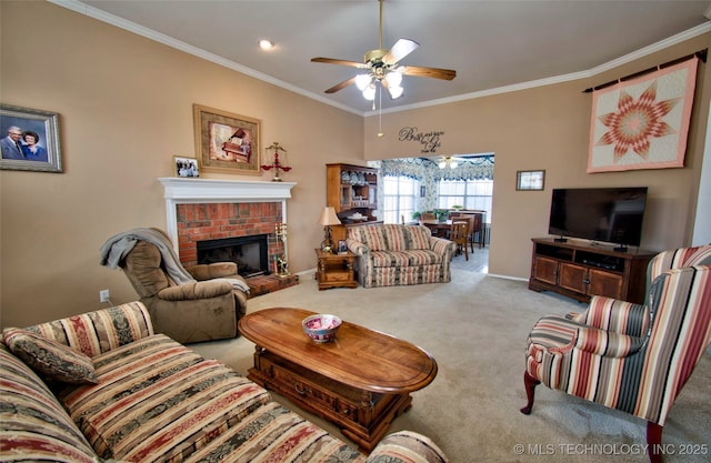 carpeted living area featuring baseboards, ornamental molding, and a ceiling fan