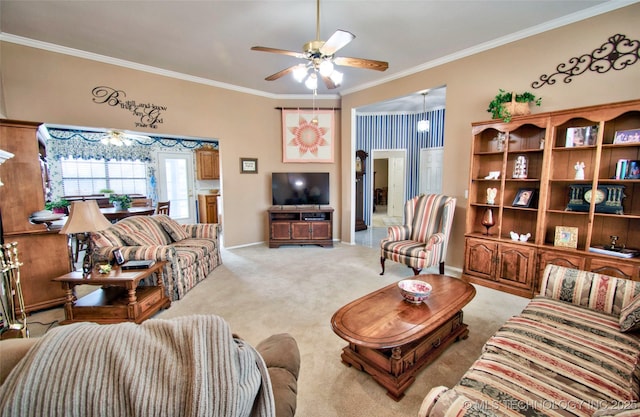 carpeted living room featuring a ceiling fan, baseboards, and ornamental molding