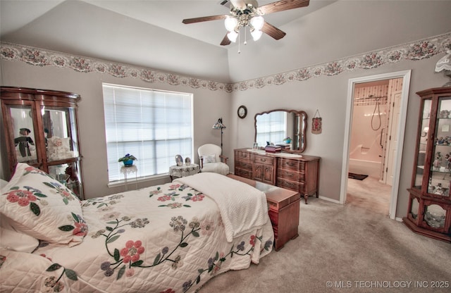 bedroom with vaulted ceiling, light colored carpet, baseboards, and ceiling fan