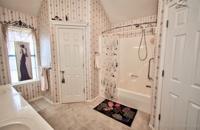 full bath with shower / bath combo, wallpapered walls, tile patterned flooring, lofted ceiling, and vanity