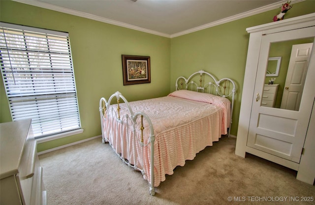 carpeted bedroom with crown molding and baseboards