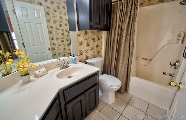 full bathroom featuring wallpapered walls, toilet, vanity, and tile patterned flooring