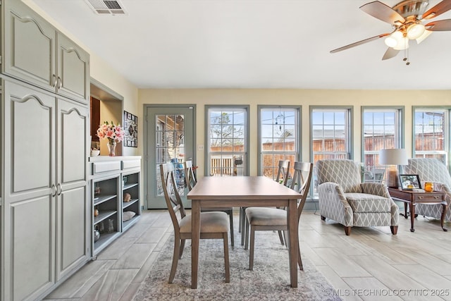 dining area featuring visible vents and ceiling fan