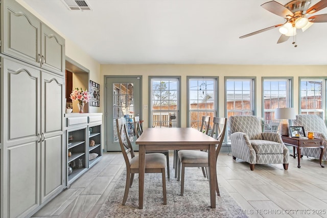 dining area featuring visible vents and a ceiling fan