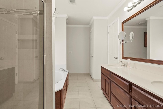 bathroom with a stall shower, crown molding, a garden tub, and a sink