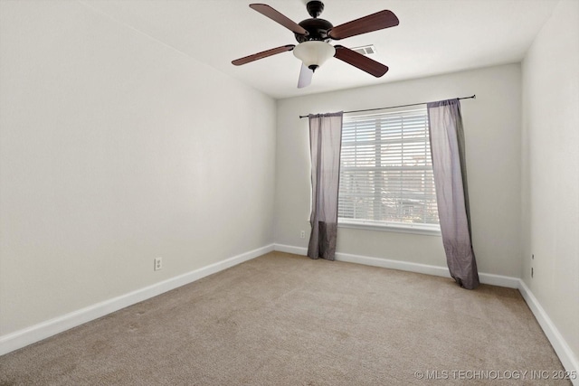 unfurnished room featuring visible vents, a ceiling fan, baseboards, and light carpet