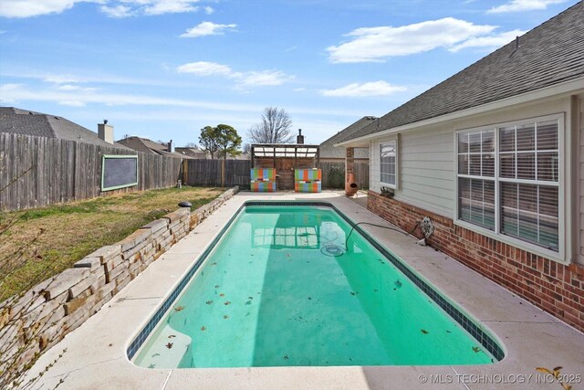 view of pool featuring a fenced in pool, a fenced backyard, and a patio area