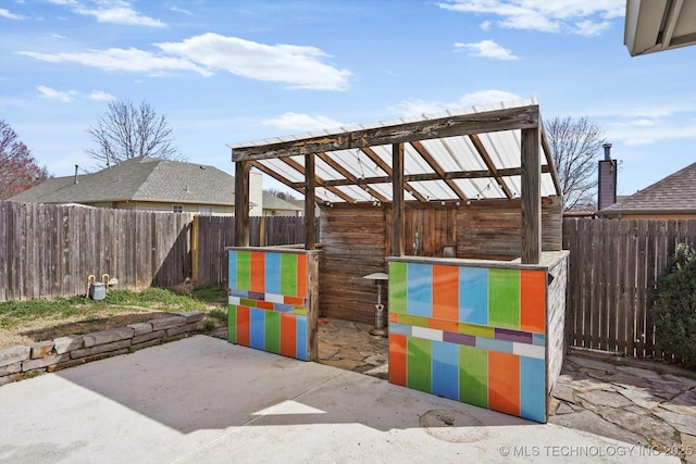 view of patio featuring an outdoor structure and an exterior structure