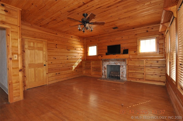 unfurnished living room featuring wood finished floors, a fireplace, wooden ceiling, and ceiling fan