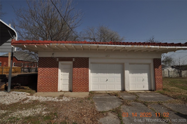 garage featuring fence