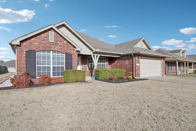 ranch-style home featuring a garage, brick siding, roof with shingles, and driveway