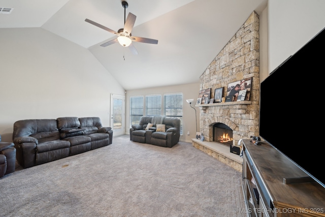 carpeted living room featuring visible vents, high vaulted ceiling, a fireplace, and a ceiling fan