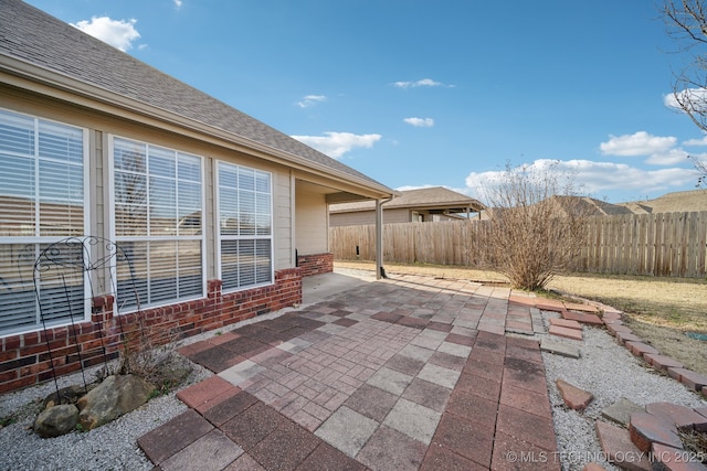 view of patio / terrace featuring fence