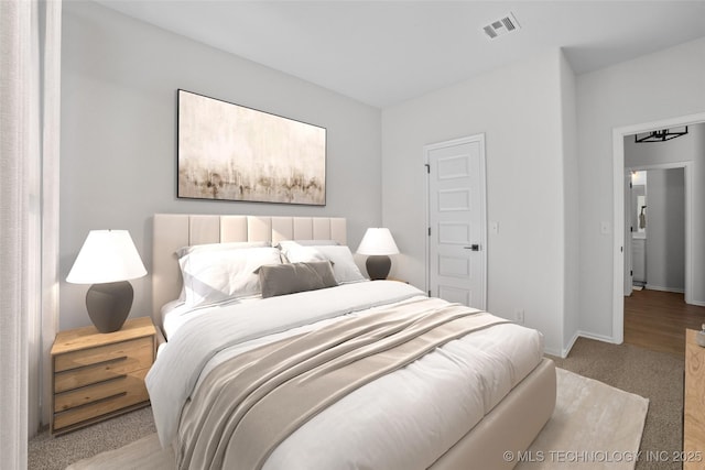 bedroom with visible vents, baseboards, and carpet floors