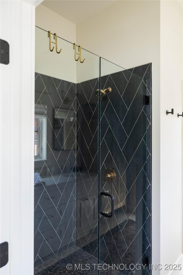 bathroom with a shower stall