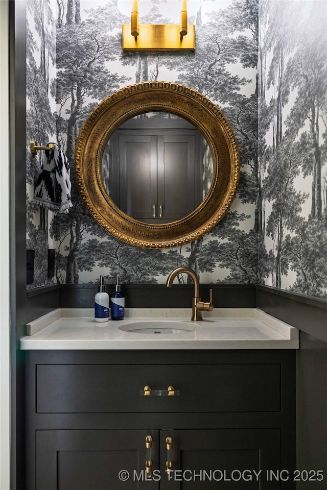 bathroom with wallpapered walls and vanity