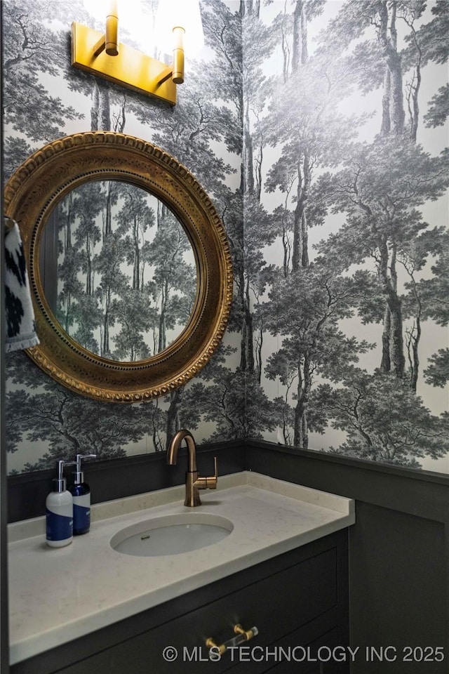 bathroom featuring wallpapered walls and vanity