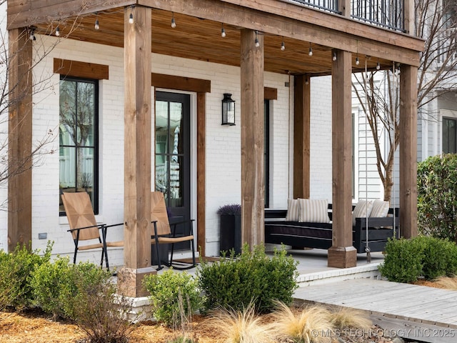 26 Boardwalk, Carlton Landing, OK 74432 - property entrance with brick siding and a porch