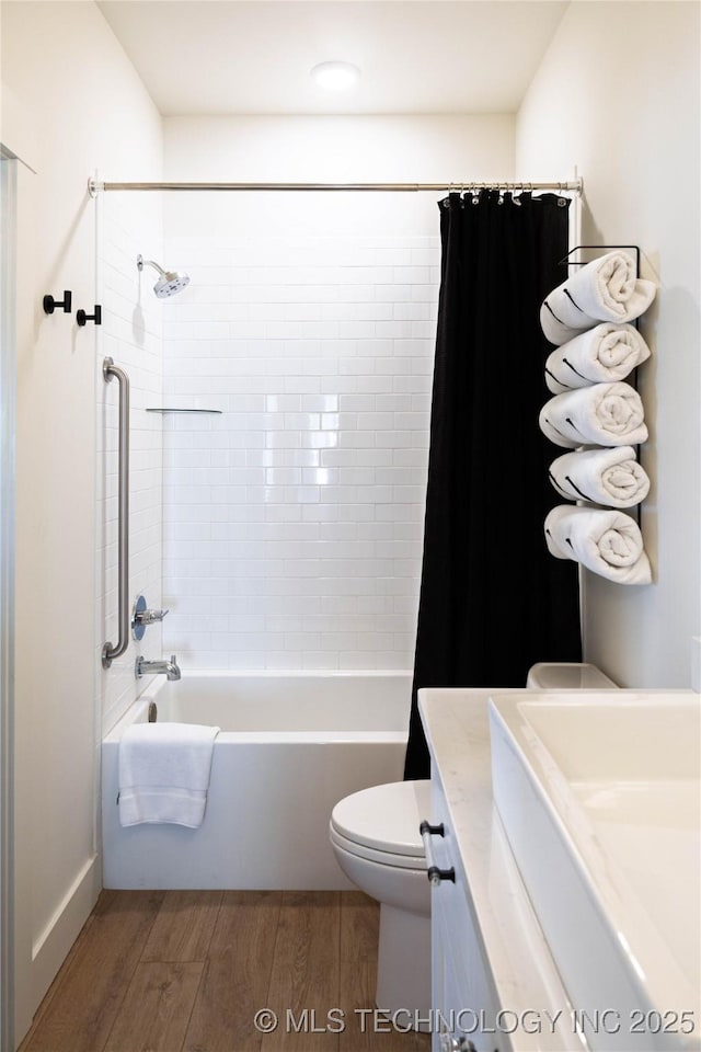 full bath featuring shower / bathtub combination with curtain, toilet, wood finished floors, and vanity