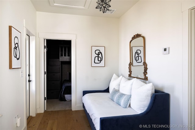 living area featuring wood finished floors and visible vents