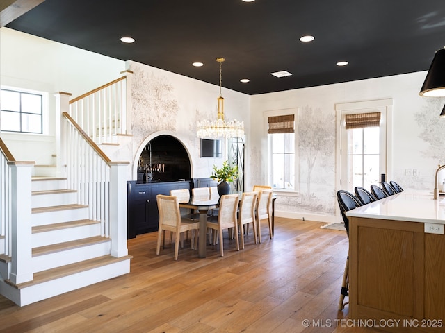 26 Boardwalk, Carlton Landing, OK 74432 - dining area featuring light wood finished floors, stairway, healthy amount of natural light, a chandelier, and recessed lighting