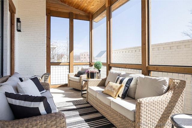 sunroom / solarium featuring vaulted ceiling