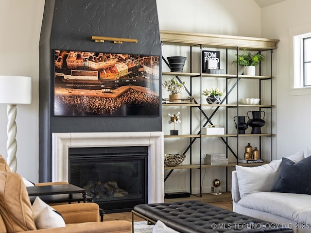 26 Boardwalk, Carlton Landing, OK 74432 - living area featuring wood finished floors and a glass covered fireplace