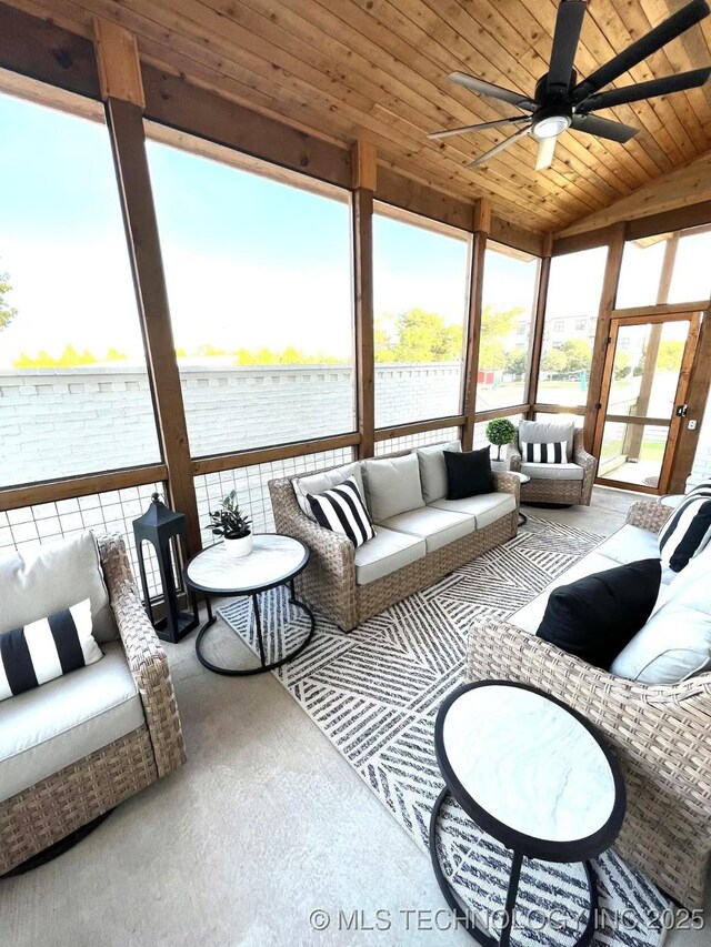 sunroom featuring lofted ceiling, wood ceiling, and ceiling fan