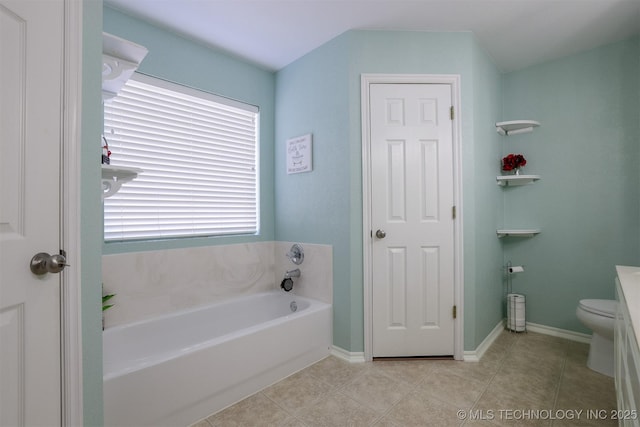 full bathroom with tile patterned flooring, a garden tub, and baseboards