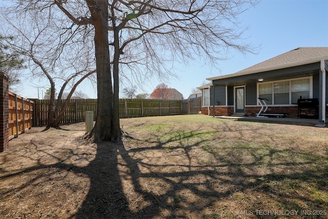 view of yard featuring a fenced backyard