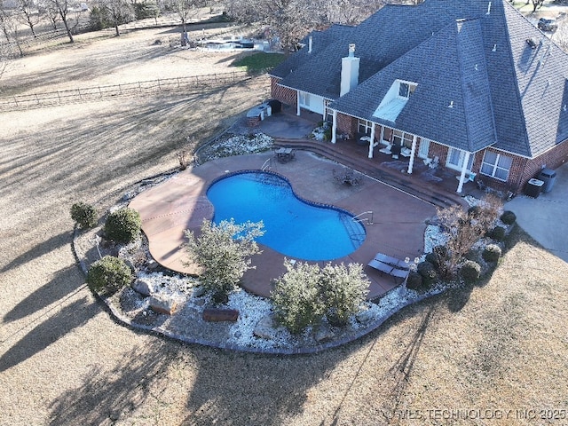 view of pool with a fenced in pool, cooling unit, fence private yard, and a patio area