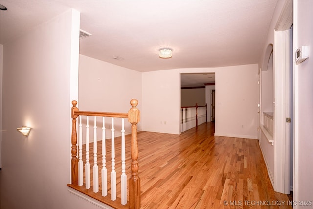 interior space with light wood-type flooring and visible vents