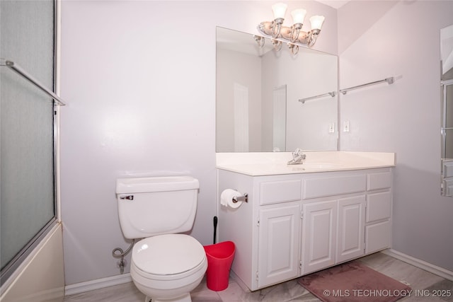 bathroom featuring enclosed tub / shower combo, toilet, and vanity