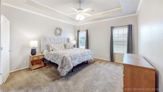 bedroom featuring visible vents, baseboards, ornamental molding, carpet flooring, and a raised ceiling