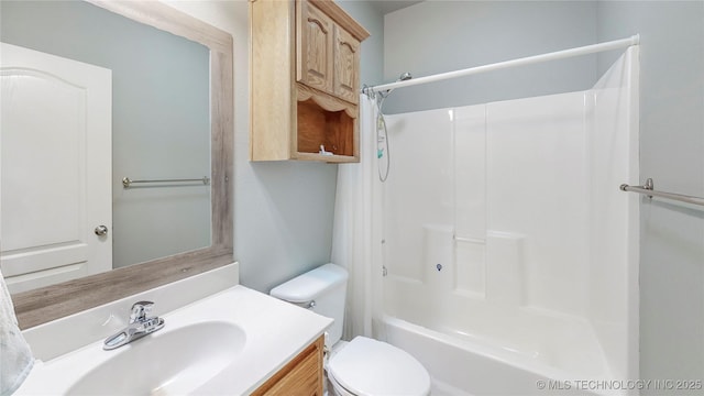 full bath featuring shower / bathtub combination, toilet, and vanity