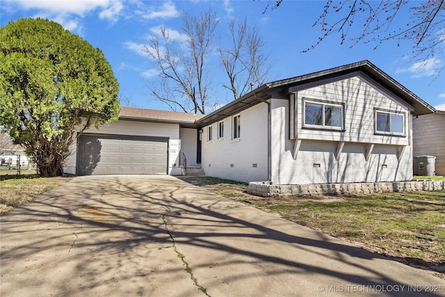 view of front of property featuring an attached garage and concrete driveway