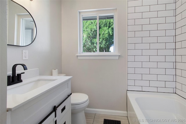 bathroom featuring visible vents, toilet, shower / washtub combination, baseboards, and vanity