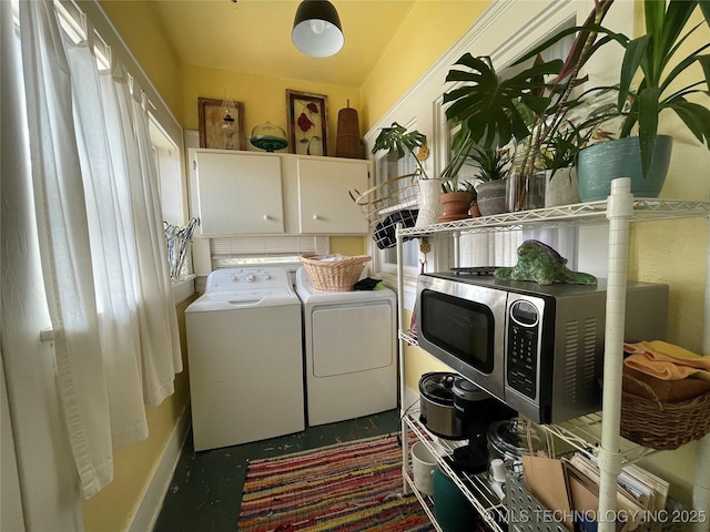 laundry area with cabinet space and washing machine and dryer