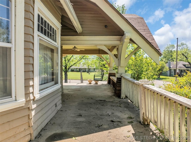 view of side of home with roof with shingles
