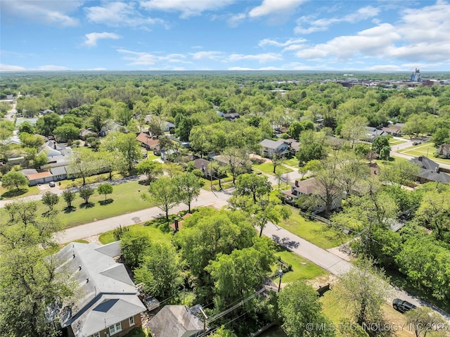 birds eye view of property with a forest view and a residential view