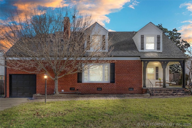 view of front facade featuring crawl space, covered porch, an attached garage, and a front yard