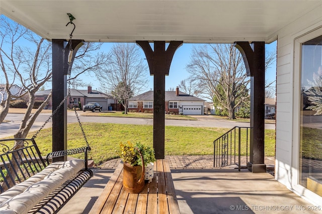 view of patio / terrace featuring a residential view and covered porch